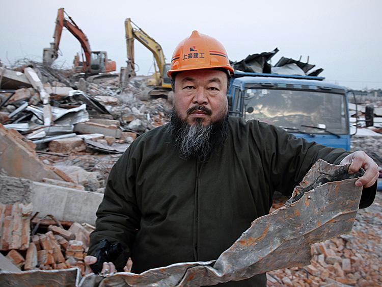 Chinese artist Ai Weiwei, 53, holds a piece of debris on January 11 after his newly built Shanghai studio was demolished. Ai is one of China's most famous, and defiant artists. He was arrested by authorities at Beijing Airport on Sunday and his whereabouts are unknown. (STR/AFP/Getty Images) Chinese artist Ai Weiwei, 53, holds a piece of debris on January 11 after his newly built Shanghai studio was demolished. Ai is one of China's most famous, and defiant artists. He was arrested by authorities at Beijing Airport on Sunday and his whereabouts are unknown. (STR/AFP/Getty Images)