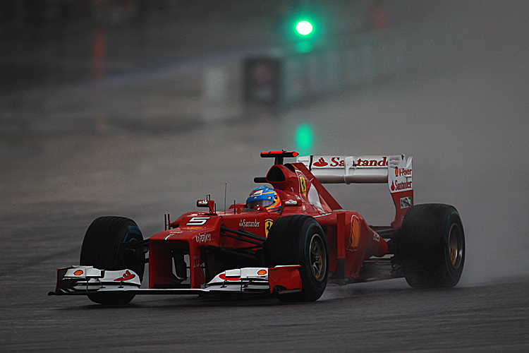 Malaysian F1 Grand Prix - Race Fernando Alonso of Ferrari drives through the rain on his way to winning the Formula One Malaysian Grand Prix. (Mark Thompson/Getty Images)