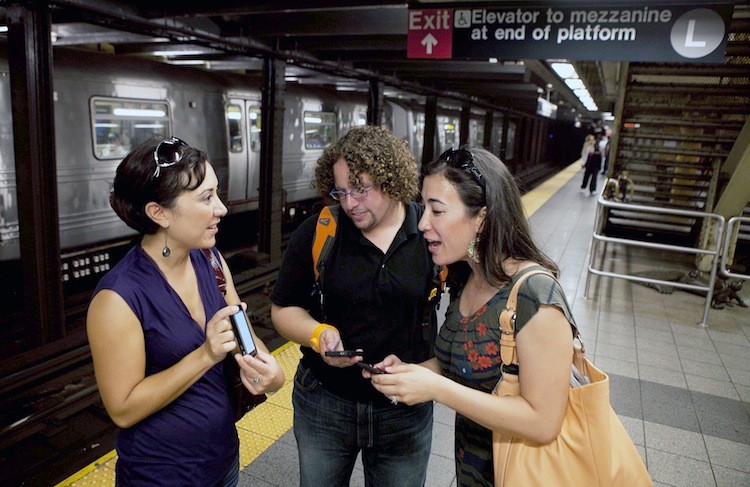 Kirsten Mickelson (R) of San Francisco, Ben Abo (C) of New Jersey, and Amy Coren of Washington D.C. try out the new underground wireless service announced on Tuesday. (Amal Chen/The Epoch Times) Kirsten Mickelson (R) of San Francisco, Ben Abo (C) of New Jersey, and Amy Coren of Washington D.C. try out the new underground wireless service announced on Tuesday. (Amal Chen/The Epoch Times)