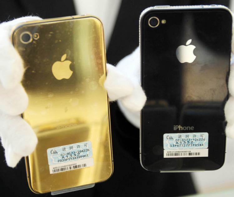 A shopkeeper shows golden accessories of Iphone at a shopping mall on March 25, 2011 in Qingdao, China. (ChinaFotoPress/Getty Images) A shopkeeper shows golden accessories of Iphone at a shopping mall on March 25, 2011 in Qingdao, China. (ChinaFotoPress/Getty Images)