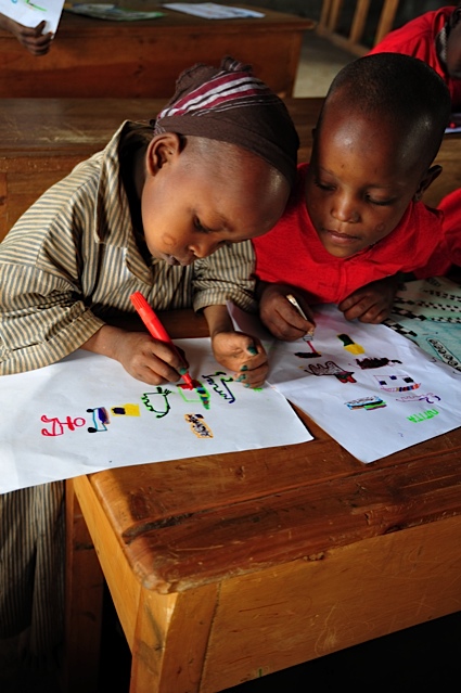 Students create art for their pen pals in England. The local primary school has received funding from the beadwork sales of the village women and is being assisted by ASK to improve the curriculum. (Courtesy of ASK) Students create art for their pen pals in England. The local primary school has received funding from the beadwork sales of the village women and is being assisted by ASK to improve the curriculum. (Courtesy of ASK)