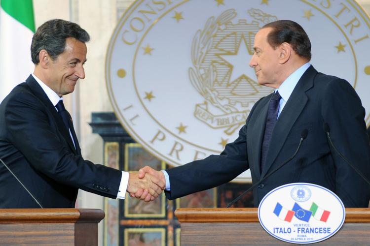 COMMON CAUSE: French President Nicolas Sarkozy and Italian Prime Minister Silvio Berlusconi (R) shake hands at the end of a summit on April 26 in Rome. The two leaders are spearheading a call to allow EU member states to reimpose internal border controls more easily. (Andreas Solaro/Getty Images ) COMMON CAUSE: French President Nicolas Sarkozy and Italian Prime Minister Silvio Berlusconi (R) shake hands at the end of a summit on April 26 in Rome. The two leaders are spearheading a call to allow EU member states to reimpose internal border controls more easily. (Andreas Solaro/Getty Images )
