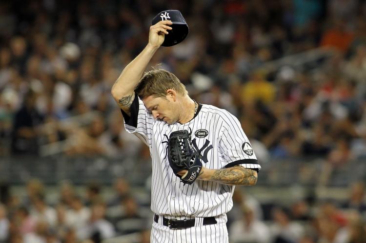 TOUGH GAME: Yankees pitcher A.J. Burnett gave up six doubles for seven runs in the fifth inning of Monday's game against the Toronto Blue Jays.