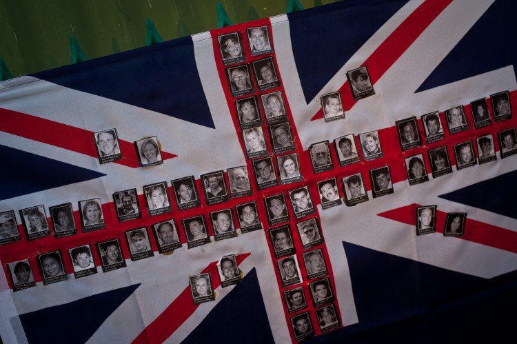 Bali-10th Anniversary-Kuta-Bombings-Terror- An Australian flag made up of photographs of victims of the 2002 bomb blast is seen on a fence at the site of the Sari Club in Jalan Legian, Bali, on Oct. 10, 2012. Many relatives and foreign tourists have begun to arrive to take part in ceremonies marking the 10th anniversary of the bomb attack in the Kuta tourist district. (Chris McGrath/Getty Images)