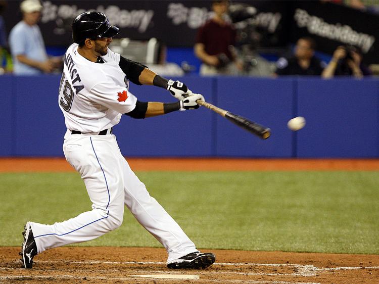 SINGLEHANDED: Jose Bautitsta's two home runs gave the Blue Jays a 3-2 win over the Yankees. (Abelimages/Getty Images)