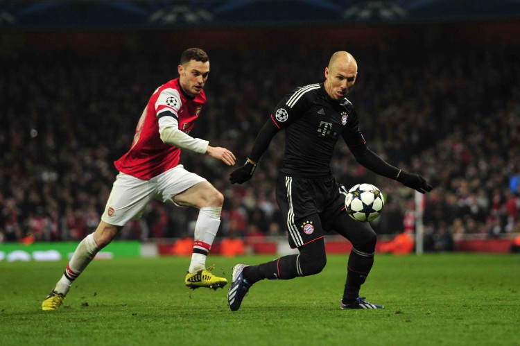 FBL-EUR-C1-ARSENAL-BAYERN MUNICH Bayern Munich winger Arjen Robben evades Arsenal defender Thomas Vermaelen at the Emirates Stadium in London, England in Champions League action on Feb. 19. (Glyn Kirk/AFP/Getty Images)
