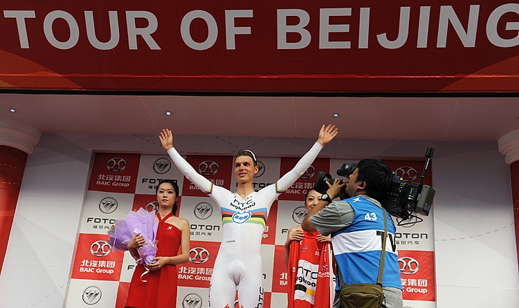 Tony Martin (C) will be back to defend his 2011 Tour of Beijing title, riding for Omega Pharma-Quickstep this year. Here he celebrates on the podium in Beijing, October 5, 2011. (Liu Jin/AFP/Getty Images)
