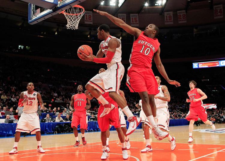 BIG EAST TOURNAMENT: Paris Horne of the St. John's Red Storm is challenged by Rutgers' James Beatty in second round action at Madison Square Garden on Wednesday. (Chris Trotman/Getty Images)