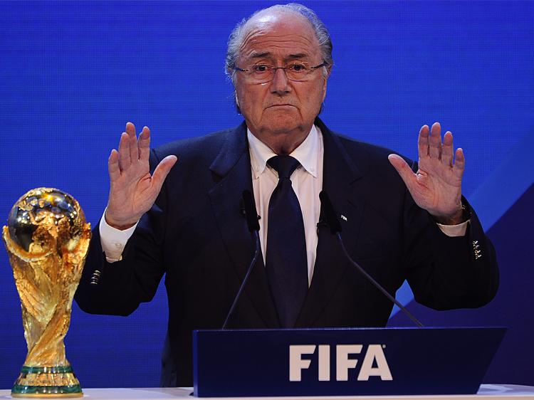WORLD CUP WINNERS: FIFA President Joseph Blatter quiets the crowd before announcing that Russia and Qatar will host the 2018 and 2022 World Cup tournaments. (Fabrice Coffrini/AFP/Getty Images) WORLD CUP WINNERS: FIFA President Joseph Blatter quiets the crowd before announcing that Russia and Qatar will host the 2018 and 2022 World Cup tournaments. (Fabrice Coffrini/AFP/Getty Images)