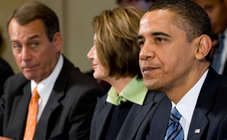 Senate Minority Leader Senator John Boehner (L) of Ohio sits with President Obama and Speaker of the House Nancy Pelosi during a meeting with members of Congress in the Cabinet Room of the White House Dec. 9. On the same day, Boehner criticized Democrats  (Saul Loeb/AFP/Getty)