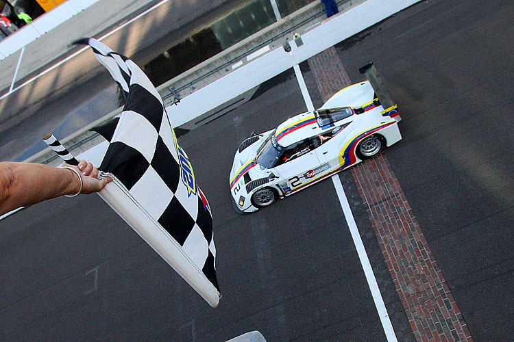 2012 Grand Am Indy Sebastian Bourdais takes the checkered flag at the Rolex Brickyard grand Prix for himself, co-driver Alex Popow, ands Starworks Racing. (Grand-Am.com)