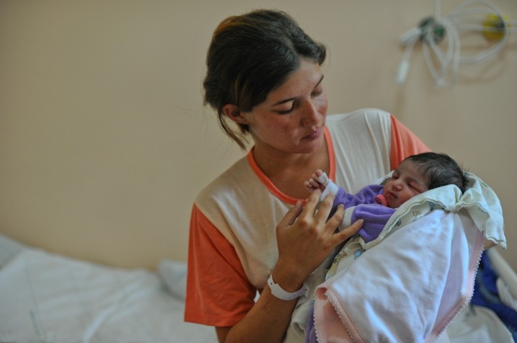 A Brazilian mother holds her newborn baby at Amparo Maternal hospital in São Paulo, Brazil, on Oct. 31, 2011. The rate of c-sections in Brazil is almost three times as the maximum rate recommended by the World Health Organization. (Yasuyoshi Chiba/AFP/Getty Images) A Brazilian mother holds her newborn baby at Amparo Maternal hospital in São Paulo, Brazil, on Oct. 31, 2011. The rate of c-sections in Brazil is almost three times as the maximum rate recommended by the World Health Organization. (Yasuyoshi Chiba/AFP/Getty Images)