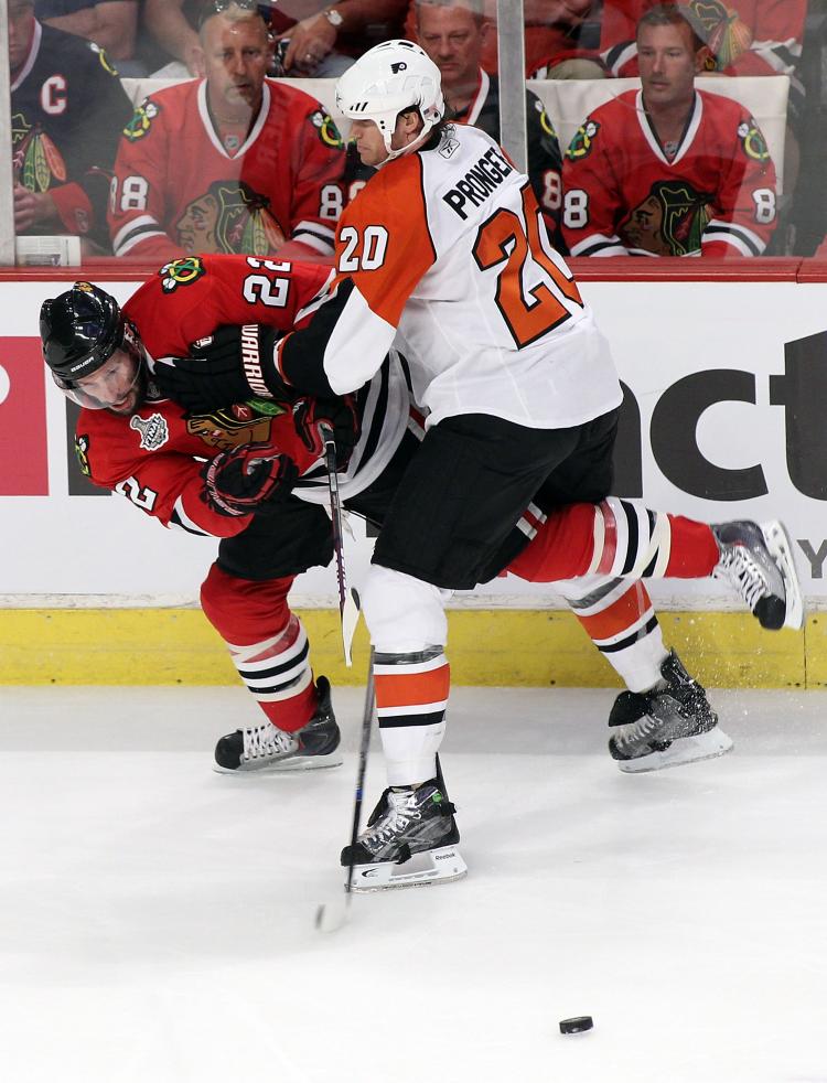 STANLEY CUP FINAL: Troy Brouwer (left) of Chicago tangles with Philadelphia's Chris Pronger. (Andre Ringuette/Getty Images) STANLEY CUP FINAL: Troy Brouwer (left) of Chicago tangles with Philadelphia's Chris Pronger. (Andre Ringuette/Getty Images)