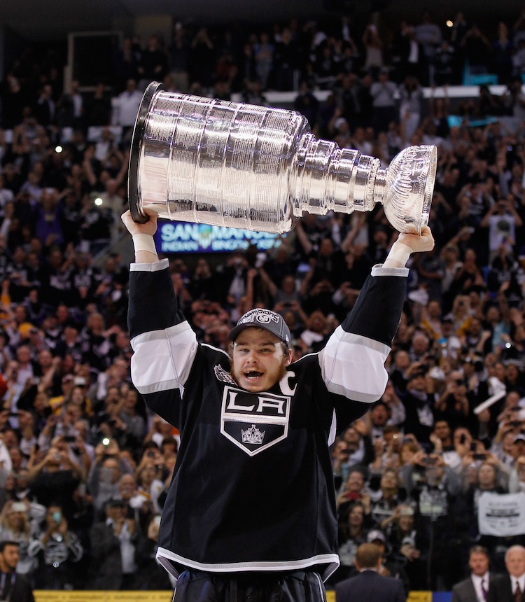 2012 NHL Stanley Cup Final - Game Six Los Angeles Kings captain Dustin Brown hoists the Stanley Cup. (Bruce Bennett/Getty Images)