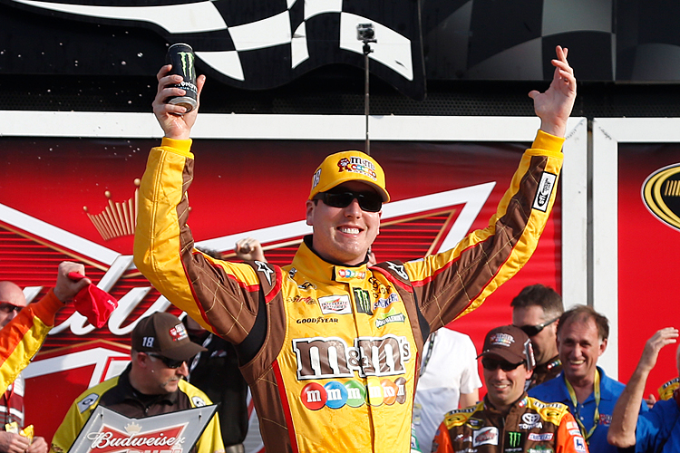 Kyle Busch, driver of the #18 M&M's Toyota, celebrates in Victory Lane after winning the NASCAR Sprint Cup Series Budweiser Duel 2 at Daytona International Speedway on February 21, 2013 in Daytona Beach, Florida. (Chris Graythen/Getty Images)