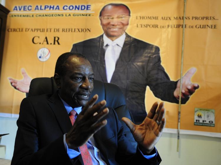 VOTE ON HOLD: Alpha Conde, Guinean presidential candidate for the Rally of the Guinean People Party, is photographed on Sept. 16 at party headquarters in Conakry, Guinea. (Issouf Sanogo/AFP/Getty Images) VOTE ON HOLD: Alpha Conde, Guinean presidential candidate for the Rally of the Guinean People Party, is photographed on Sept. 16 at party headquarters in Conakry, Guinea. (Issouf Sanogo/AFP/Getty Images)