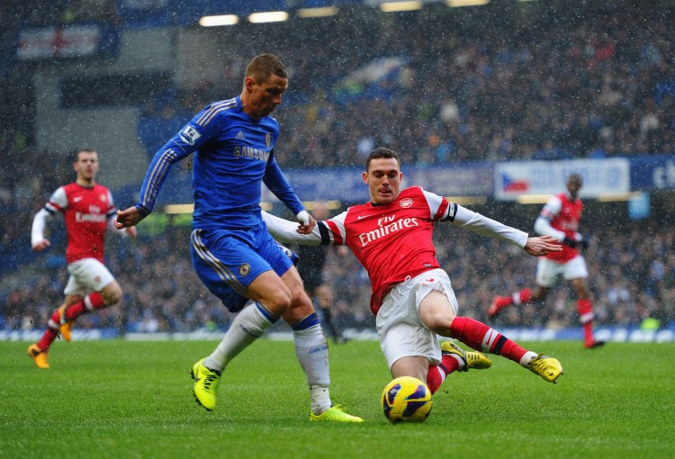 Chelsea's Fernando Torres (L) competes for the ball with Arsenal's Thomas Vermaelen at Stamford Bridge in London, England on Sunday, Jan. 20, 2012. (Laurence Griffiths/Getty Images) 