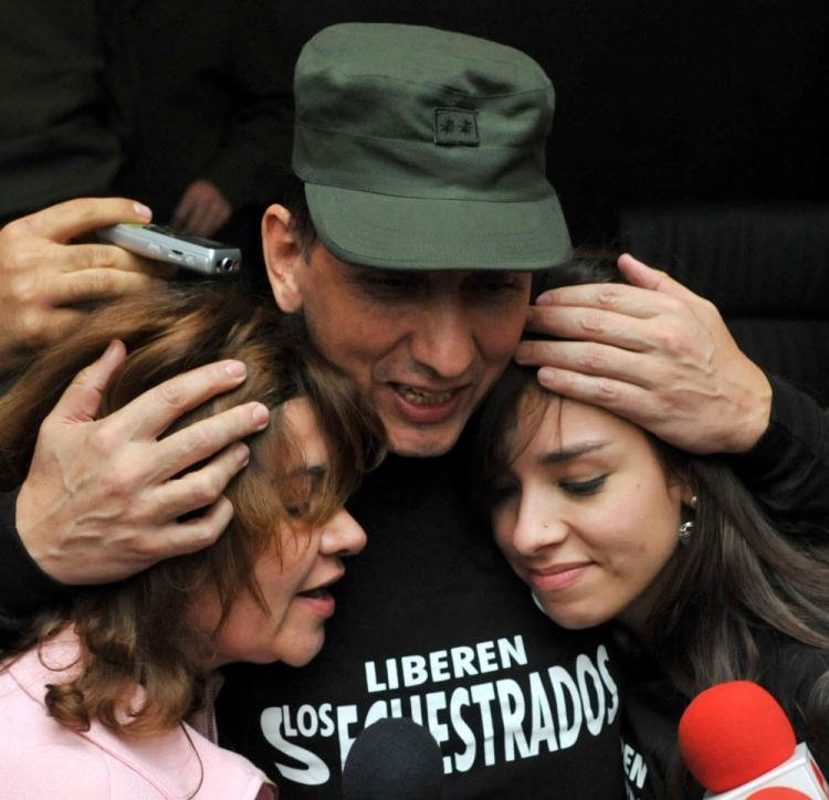 After being held hostage for nearly 12 years by Marxist rebel organization FARC, Gen. Herlindo Luis Mendieta (C) embraces his daughter (R) and wife after being liberated by the Colombian National Police on June 13. (Guillermo Legaria/AFP/Getty Images) After being held hostage for nearly 12 years by Marxist rebel organization FARC, Gen. Herlindo Luis Mendieta (C) embraces his daughter (R) and wife after being liberated by the Colombian National Police on June 13. (Guillermo Legaria/AFP/Getty Images)