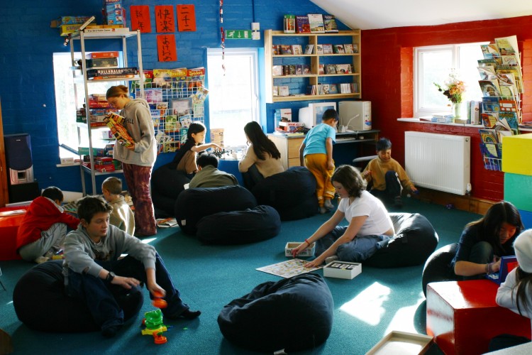 Children relaxed and absorbed in the Summerhill school cafe. (Courtesy of Summerhill School)