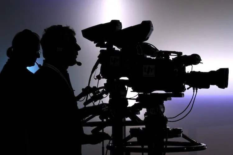 Television cameramen film in a broadcast studio in this file photo. (Fabrice Coffrini/Getty Images)