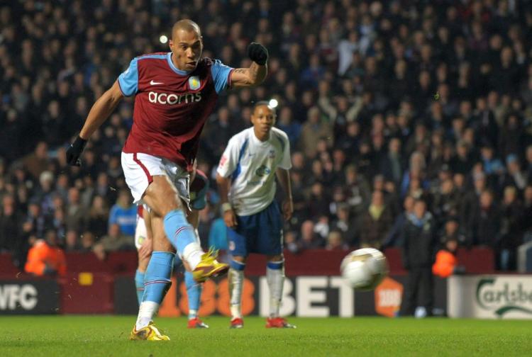 Aston Villa's John Carew completes his hat trick. (Paul Ellis/AFP/Getty Images) Aston Villa's John Carew completes his hat trick. (Paul Ellis/AFP/Getty Images)
