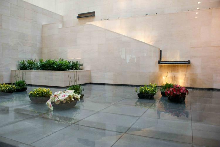 The Water Garden in the lobby, a very Asian and serene feature. Granite weirs and a reflecting pool with planters sit beyond the lobby's glass wall. (Charlotte Cuthbertson/The Epoch Times) The Water Garden in the lobby, a very Asian and serene feature. Granite weirs and a reflecting pool with planters sit beyond the lobby's glass wall. (Charlotte Cuthbertson/The Epoch Times)