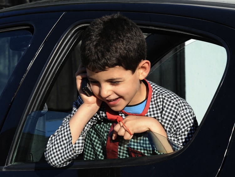 Cell-phone use by children and adolescents poses health risks. (Fethi Belaid/AFP/Getty Images) Cell-phone use by children and adolescents poses health risks. (Fethi Belaid/AFP/Getty Images)