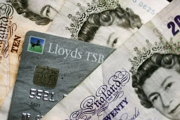 A chip-and-PIN card is mixed in with Bank of England notes. (Christopher Furlong/Getty Images)