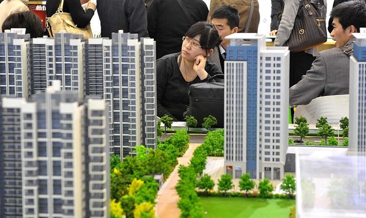 Chinese house shoppers gather at a property fair in Beijing on August 2, 2010. (AFP/Getty Images) Chinese house shoppers gather at a property fair in Beijing on August 2, 2010. (AFP/Getty Images)