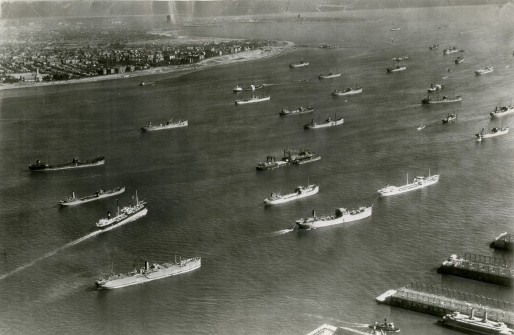  After the passage of the Lend-Lease bill, enabling the U.S. to supply the Allies, New York was a major war material port. Pictured are some of the nearly 100 British, Dutch, and Norwegian merchant ships passing through New York harbor on Sept. 9, 1941. (Courtesy of the New York Historical Society)
