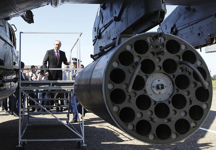 Russia's President Vladimir Putin inspects Mi-24 ground-attack helicopters as he visits a military airbase in the city of Korenovsk, about 1200 km (750 miles) south of Moscow, on June 14. (Mikhail Klimentyev/AFP/GettyImages) Epoch Times Photo