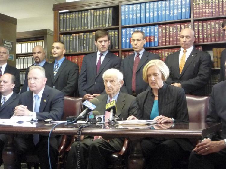 JUSTICE: Manhattan District Attorney Robert M. Morgenthau (C) and Special Narcotics Prosecutor Bridget G. Brennan (R) announce the indictment of four Bronx drug traffickers. (Christine Lin/The Epoch Times)