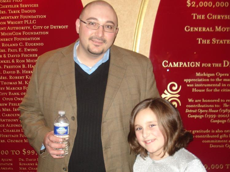Mr. Bratic and his daughter enjoy Shen Yun Performing Arts at the Detroit Opera House.  (Diana Hubert/The Epoch Times)