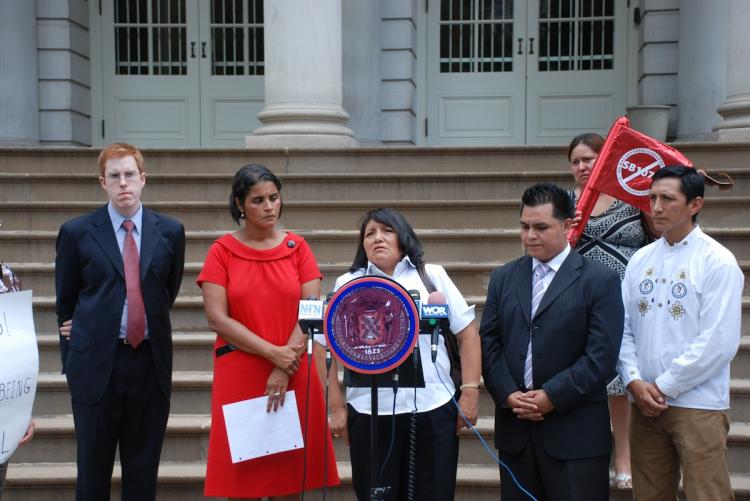 Julia Quintuna, the mother of Jose Sucuzhnay, speaks at City Hall on Thursday. (Susan Tan/Epoch Times Staff)