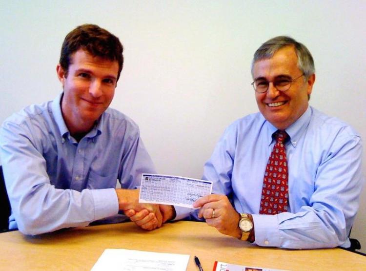 Daniel Gilbert (l) gives Al Cross, director of the Institute for Rural Journalism and Community Issues, a check for $10,000 to launch the Rural Computer-Assisted Reporting. (Courtesy of Daniel Gilbert) Daniel Gilbert (l) gives Al Cross, director of the Institute for Rural Journalism and Community Issues, a check for $10,000 to launch the Rural Computer-Assisted Reporting. (Courtesy of Daniel Gilbert)
