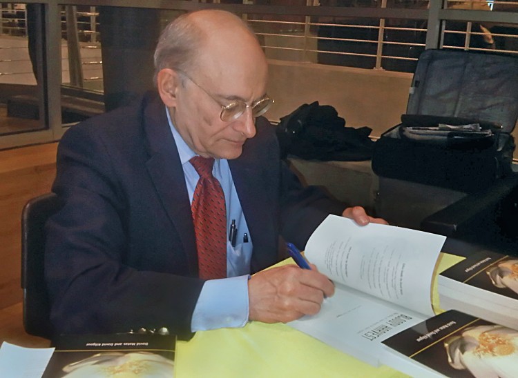 Human rights lawyer David Matas signs his book 'Bloody Harvest: The Killing of Falun Gong for Their Organs' at a book signing event and talk at Columbia University. (Jan Jekielek/The Epoch Times) Human rights lawyer David Matas signs his book 'Bloody Harvest: The Killing of Falun Gong for Their Organs' at a book signing event and talk at Columbia University. (Jan Jekielek/The Epoch Times)