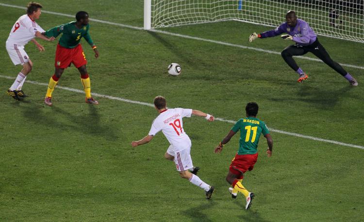 Dennis Rommedahl (No. 19) curls the ball into the net for the game-winning goal. (Chris McGrath/Getty Images)