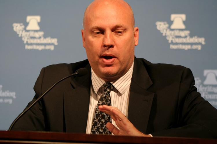 Dr. Derek Scissors doubts that punishing China for undervaluing its currency would do anything about the trade deficit or create jobs. He spoke Sept. 14 at the Heritage Foundation, where he is a Research Fellow. (Gary Feuerberg/ Epoch Times) Dr. Derek Scissors doubts that punishing China for undervaluing its currency would do anything about the trade deficit or create jobs. He spoke Sept. 14 at the Heritage Foundation, where he is a Research Fellow. (Gary Feuerberg/ Epoch Times)