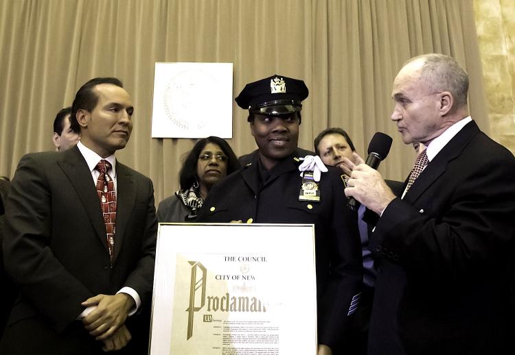 BRAVERY HONORED: Detective Feris Jones is given a proclamation by the Police Commissioner Raymond Kelly (right) on Monday in Brooklyn. While off-duty, Jones foiled a robbery at a hair salon in October. (Phoebe Zheng/The Epoch Times) BRAVERY HONORED: Detective Feris Jones is given a proclamation by the Police Commissioner Raymond Kelly (right) on Monday in Brooklyn. While off-duty, Jones foiled a robbery at a hair salon in October. (Phoebe Zheng/The Epoch Times)
