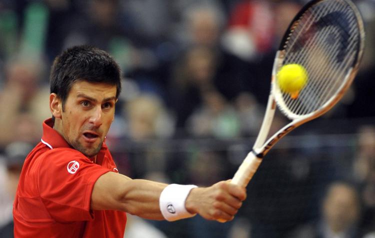 Serbia's Novak Djokovic stays focused against John Isner of the U.S. in Davis Cup first round action on Sunday. (ANDREJ ISAKOVIC/AFP/Getty Images) Serbia's Novak Djokovic stays focused against John Isner of the U.S. in Davis Cup first round action on Sunday. (ANDREJ ISAKOVIC/AFP/Getty Images)