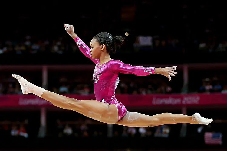 Gabrielle Douglas of the United States soars above the balance beam during the Artistic Gymnastics Women's Individual All-Around final on Day 6 of the London 2012 Olympic Games. (Streeter Lecka/Getty Images)