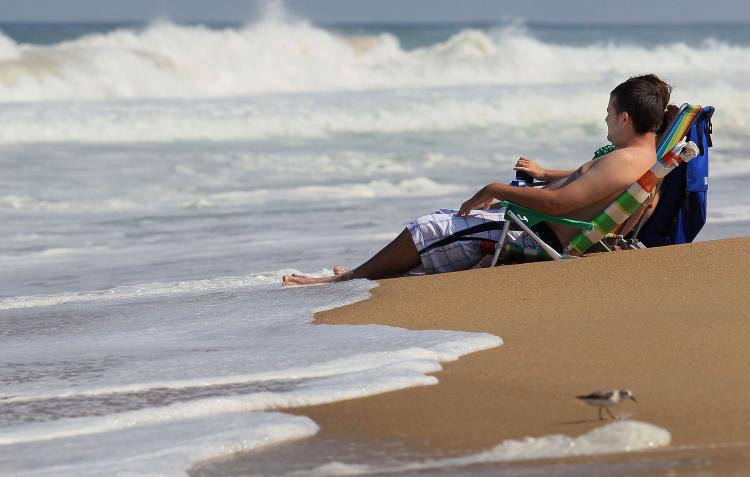 People in beach chairs watch the high surf caused by Hurricane Earl on Sept. 1 in Kitty Hawk, N.C. (Mark Wilson/Getty Images) People in beach chairs watch the high surf caused by Hurricane Earl on Sept. 1 in Kitty Hawk, N.C. (Mark Wilson/Getty Images)