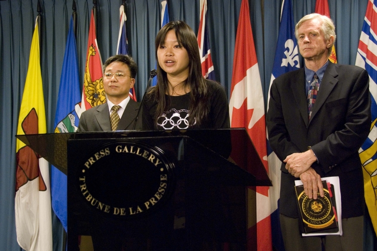 Katherine Borlongan, Executive Director of Reporters Without Borders Canada, speaking at a press conference on Parliament Hill in Ottawa on July 14, 2008 urging French satellite operator Eutelsat to restore New Tang Dynasty Television's (NTDTV Katherine Borlongan, Executive Director of Reporters Without Borders Canada, speaking at a press conference on Parliament Hill in Ottawa on July 14, 2008 urging French satellite operator Eutelsat to restore New Tang Dynasty Television's (NTDTV