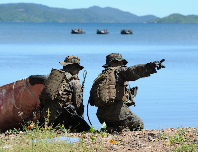 US soldiers are seen during a joint mock beachfront assault on the shore of Ulugan Bay on Palawan island on April 25. US and Filipino soldiers stormed the South China Sea island in war games that took place not far from a real-life maritime standoff between Manila and Beijing. (Ted Aljibe/AFP/Getty Images) Epoch Times Photo