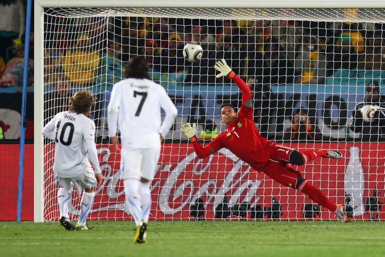 Uruguay's Diego Forlan scores on a penalty kick against South Africa in Pretoria on Wednesday. (Michael Steele/Getty Images) Uruguay's Diego Forlan scores on a penalty kick against South Africa in Pretoria on Wednesday. (Michael Steele/Getty Images)