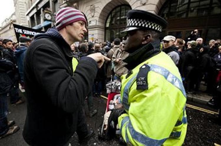 A protestor gestures to a police officer following a two minute silence at the spot where Ian Tomlinson died during the G20 demonstrations near the Bank of England in London on April 11, 2009 (BEN STANSALL/AFP/Getty Images) A protestor gestures to a police officer following a two minute silence at the spot where Ian Tomlinson died during the G20 demonstrations near the Bank of England in London on April 11, 2009 (BEN STANSALL/AFP/Getty Images)