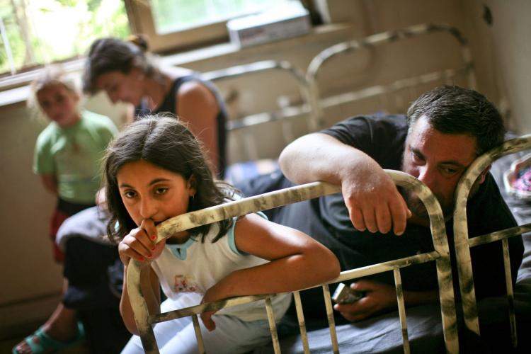 Displaced Georgians from the breakaway province of South Ossetia sit on a bed in a refugee shelter in Tbilisi, Georgia on Aug. 17, 2008. (Uriel Sinai/Getty Images) Displaced Georgians from the breakaway province of South Ossetia sit on a bed in a refugee shelter in Tbilisi, Georgia on Aug. 17, 2008. (Uriel Sinai/Getty Images)