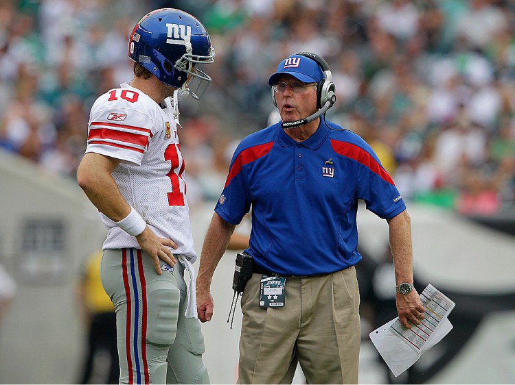 Eli Manning and Tom Coughlin discuss strategy in the final&8212and decisive&212quarter on Sunday. The Giants erased last year's collapse with a comeback win of their own. (Rob Carr/Getty Images) Eli Manning and Tom Coughlin discuss strategy in the final&8212and decisive&212quarter on Sunday. The Giants erased last year's collapse with a comeback win of their own. (Rob Carr/Getty Images)