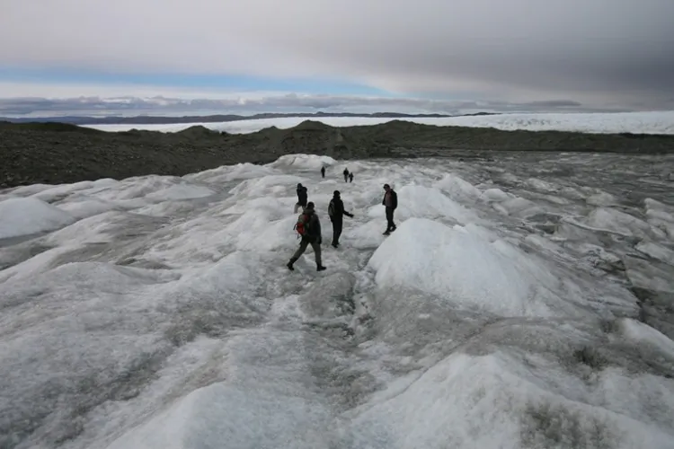 Tourists on the Greenlandic ice cap on Sept. 3, 2007. Although 80 percent of Greenland is covered in ice, beneath the ice lies abundant natural resources, such as rare earth elements. (Uriel Sinai/Getty Images)