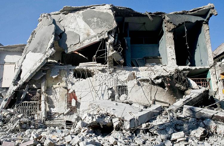 Four weeks after the devastating earthquake in Haiti a 28-year-old man was rescued from under the ruble of a collapsed building on Feb. 9. (Chris Hondros/Getty Images)